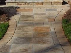 Stamped concrete can be made to look like stone, pavers or brick